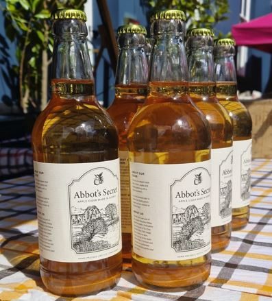 Bottles of Abbot's Secret showing the hand-drawn label of Waverley Abbey