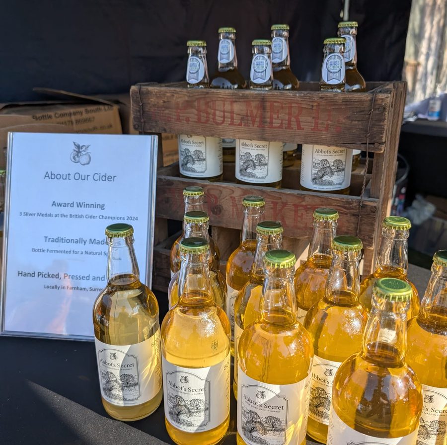 Bottles of Abbot's Secret in an old wooden crate beside an Award Winning sign